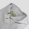 A grey hoodie with a hood and tags, featuring a logo on the tags.