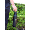 A drink bottle in matte black with a metal loop, featuring a logo and a 600ml capacity.