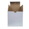 A cardboard box with an open top and flaps, featuring a plain white exterior.