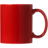 A red ceramic coffee mug with a smooth finish and a sturdy handle. The mug is packaged in a folded box.