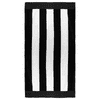 A striped beach towel featuring alternating black and white hues, with a border. It includes branding.