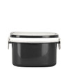 A black plastic and wheat straw lunch box with a secure lid and side clasps. Features a simple design.