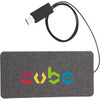 A grey fabric wireless charging pad with a USB connection and a multicoloured logo.