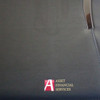 A dark blue imitation leather zippered compendium featuring a metallic clip and branding.