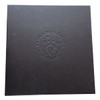 A black box with an embossed logo featuring a family and the words "Family Healthcare Services."