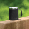 A black stainless steel coffee mug with a silver rim and handle, featuring a logo.
