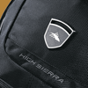 A black backpack featuring a sleek design, with textured fabric and a prominent logo embroidery.