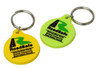 Two custom PVC keyrings in yellow and green, each featuring a logo and attached to a metal key ring.