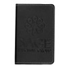 A black leather notebook with embossed branding, featuring white stitching along the edges.