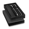 A sleek black gift box containing a set of two metal ballpoint pens with a textured finish and a leather case.