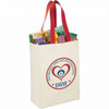 A natural cotton grocery tote in cream with red handles, featuring a logo and filled with assorted grocery items.