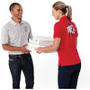 A man in a grey polo shirt hands pizza boxes to a woman in a red polo shirt. Both shirts have a logo.