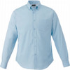 A light blue button-up shirt with long sleeves and a chest pocket, featuring a logo on the collar.