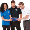 A group of three individuals wearing Crandall short sleeve polo shirts in blue, black, and white, featuring a logo.