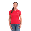 A woman wearing a red polo shirt with a logo, paired with blue jeans.