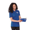 A woman wearing a blue short sleeve polo shirt with a logo, holding a clipboard and smiling.
