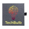 A square promotional product in grey with a colourful lightbulb graphic and a logo.