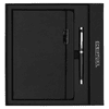 A black notebook with a pen, presented in a sleek black gift box, featuring a logo on the packaging.