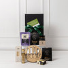 A gourmet gift pack featuring a wooden platter, condiments, oils, snacks, and a variety of packaging, all in black.