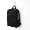 A black urban sports backpack with a front zip pocket and mesh side pocket, hanging on a blue hook.