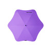 A purple BLUNT Classic Umbrella with a unique star-shaped canopy and a central hub. It features branding on the handle.