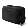 A black packing cube with a mesh panel, featuring a logo and a zipper closure.