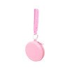 A round pink silicone pouch with a strap and zipper, featuring holes for adjustable length.