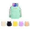 A mint green silicone phone bag with perforations, featuring an adjustable strap. Available in multiple colours including black, beige, yellow, and purple.