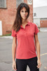 A red ladies' polo shirt with a collar and buttons, modelled by a woman in an outdoor setting.