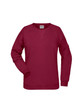 A maroon ladies' sweat jumper made of soft fabric, featuring long sleeves and a crew neck. It has a logo on the label.