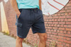 Men's lounge shorts in navy with a drawstring waist and side pockets, featuring a casual style suitable for lounging.
