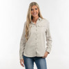 A light beige button-up flannel shirt with two chest pockets, worn by a smiling woman. The shirt features a logo.