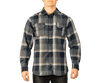 A man wearing a blue and grey checked short sleeve yarn-dyed flannel snap shirt with two chest pockets.