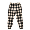 Black and white checkered flannel jogger pants with an elastic waistband and cuffed ankles.