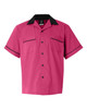 A pink bowling shirt with a black collar and trim, featuring two chest pockets and a logo.