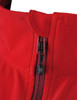 A close-up of a red ladies softshell jacket featuring a zip and collar design. The jacket has a logo on it.