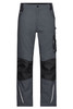 Workwear pants in grey with black panels, featuring multiple pockets and reflective detail. Includes a logo.