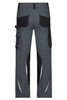 Grey workwear pants with black accents and multiple pockets at the back. Features include reflective details and a logo.