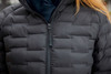 A black padded jacket featuring a zip closure and a quilted design. The fabric has a smooth finish.