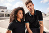 A black polo shirt for ladies and a matching black polo shirt for men, both featuring contrasting trim and a logo.