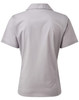 A women's short-sleeve button-up blouse in light grey with a collar and back detailing. It features a logo.