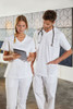 A white tunic-style uniform worn by a woman and a man, with the man holding a stethoscope.