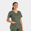 A women's double V-neck top in dark green, featuring short sleeves and a side pocket, with a logo present.