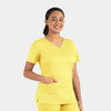 A yellow women's double V-neck top with short sleeves and a pocket, featuring a logo.