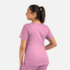 A women's double V-neck top in a light pink colour, featuring a fitted design and short sleeves, with a logo on it.