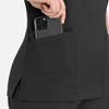 A black women's curved mock wrap top with a pocket displaying a smartphone.