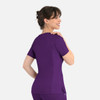 A women's curved mock wrap top in a vibrant purple colour, featuring short sleeves and a fitted design.