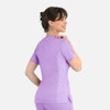 A women's curved mock wrap top in lilac with short sleeves and a fitted design, featuring a logo.