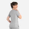 A women's curved mock wrap top in grey, featuring short sleeves and a fitted design, displayed from the back.