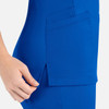 A vibrant blue women's curved mock wrap top featuring side pockets and a stylish design.